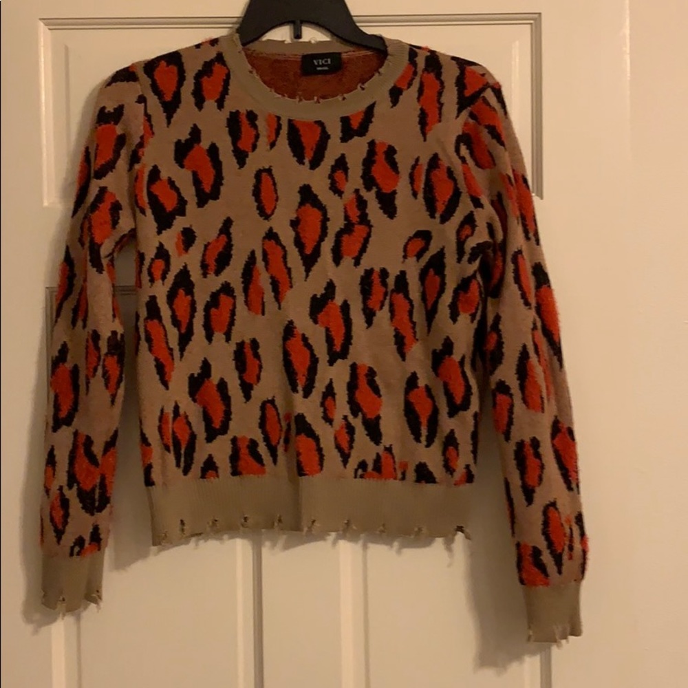 Cropped tan with red and black sweater